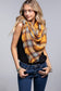 blond girl wearing yellow and brown plaid scarf