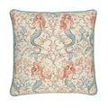 A square decorative throw pillow featuring a mermaid and coral botanical pattern in muted blue and terracotta on a cream background, finished with a teal piped edge.