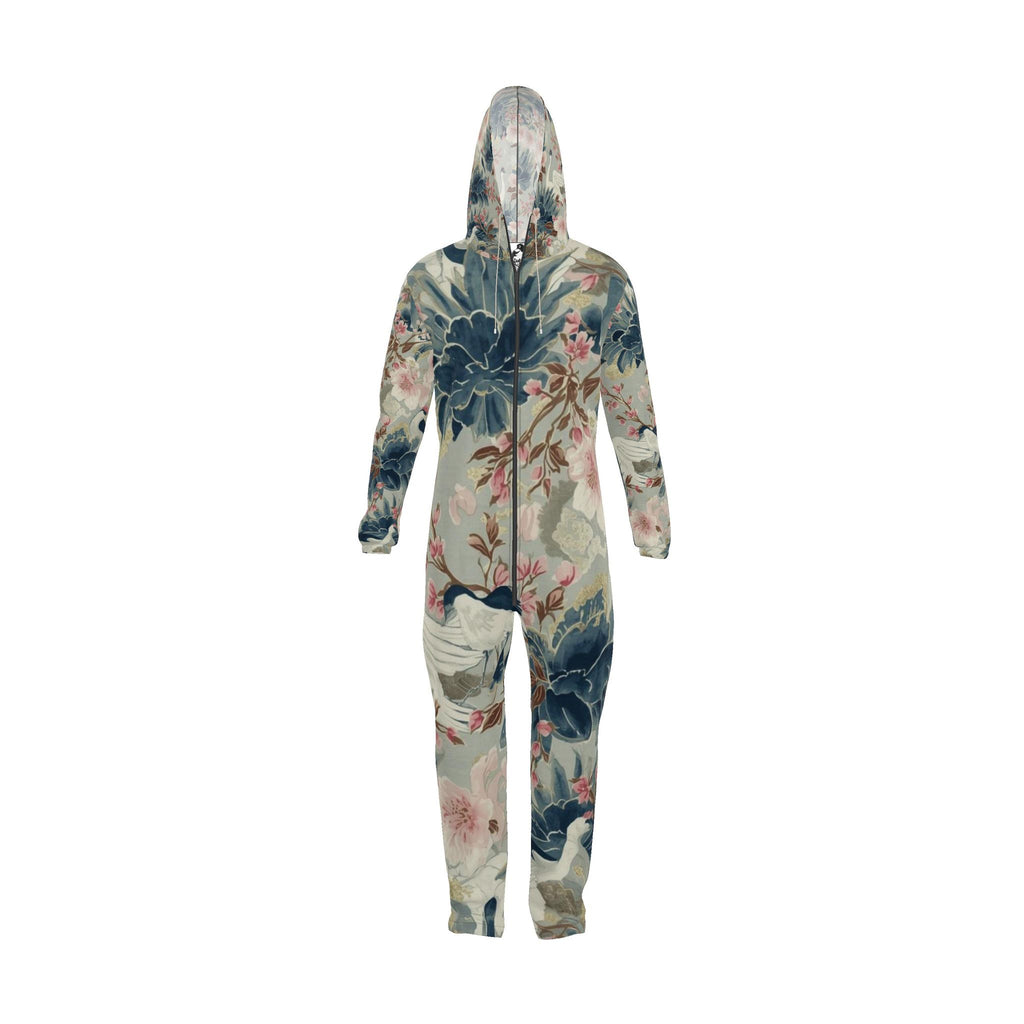 A hooded one-piece zip-up jumpsuit with a vintage-style botanical print featuring blue, pink, and green floral motifs on a light beige background, shown from the back against a plain white background.