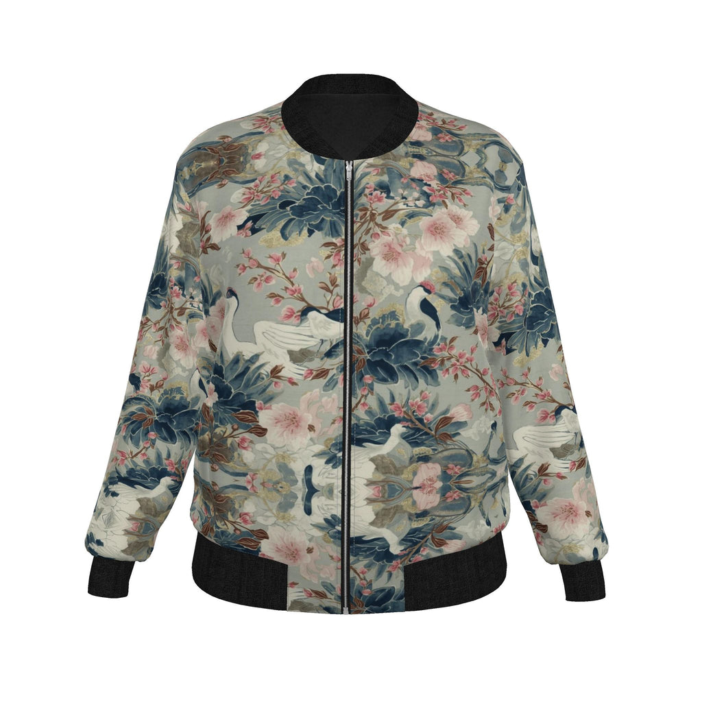 A long-sleeve bomber jacket with a detailed print of cranes, pink flowers, and blue foliage on a light grayish-beige background. It features solid black ribbed cuffs, hem, and collar, with a front zipper closure.