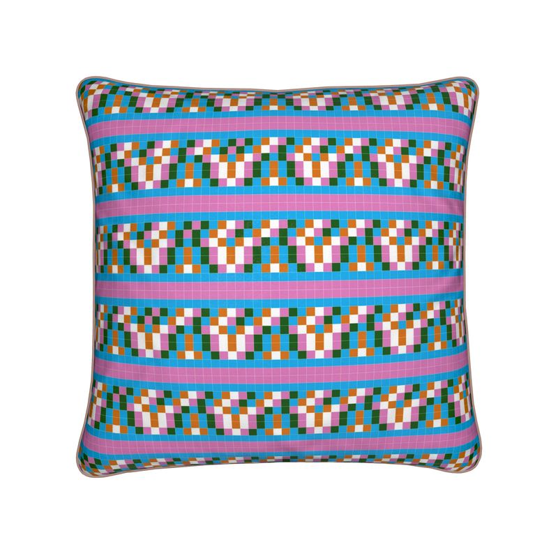 Multicolored geometric patterned pillow on a white background