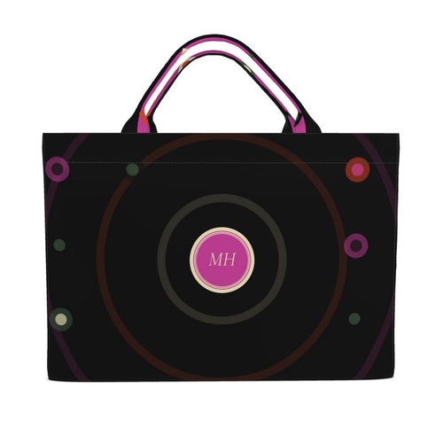 Black tote bag with circular design and 'MH' initials on a white background
